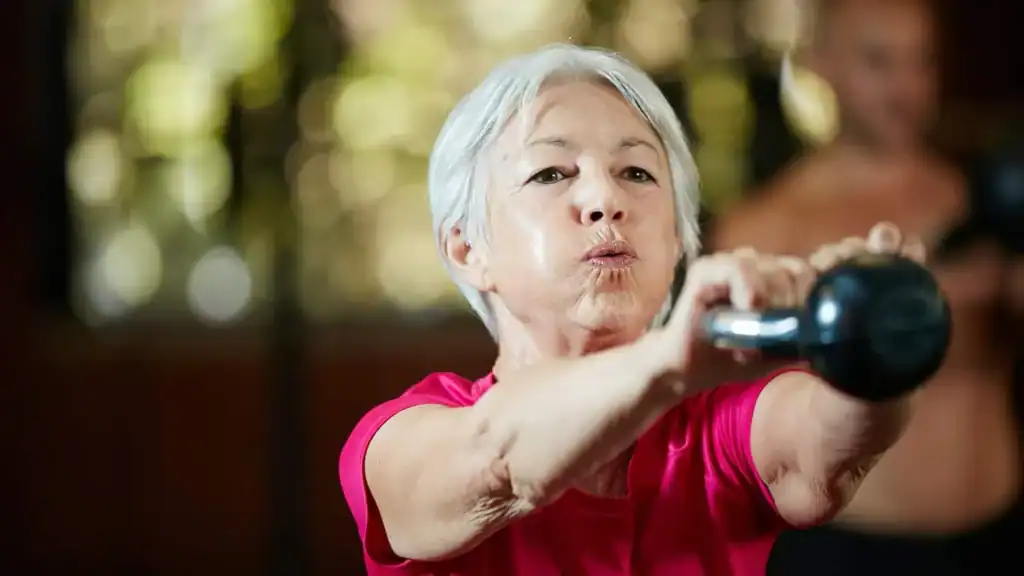 Toning Arms After 60: Empowering Womens Fitness Through Effective Weight Training 1 Older woman doing weight training Tilbury to help her strength and longevity