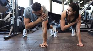 Sculpting Sleek Arms: The Essential Role of Cardio in Toning Without Bulking Up 1 Image of man and woman doing Cardio Tilbury to tone their arms.